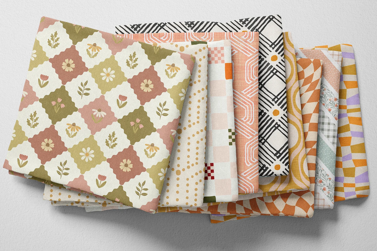 Colorful folded Spoonflower fabric with whimsical geometric prints
