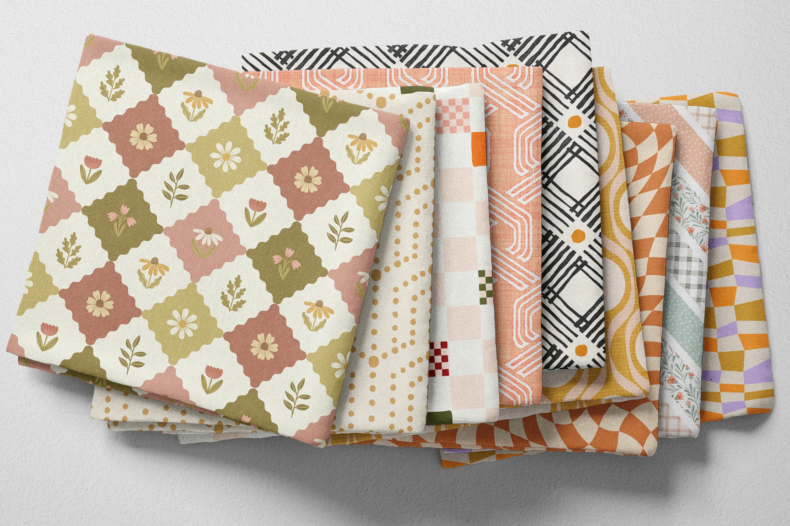 Colorful folded Spoonflower fabric with whimsical geometric prints