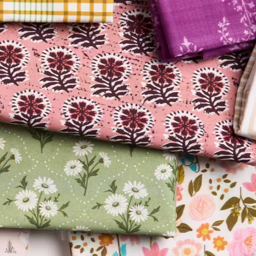 Assortment of floral fabrics in green, pink, and red
