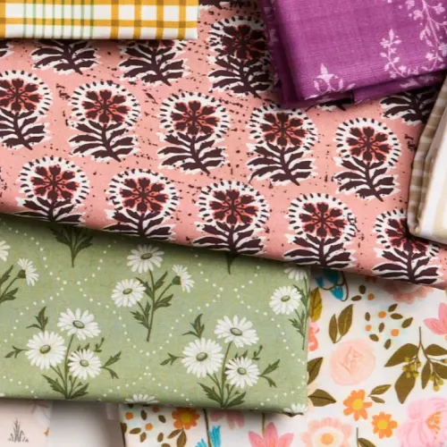 Assortment of floral fabrics in green, pink, and red