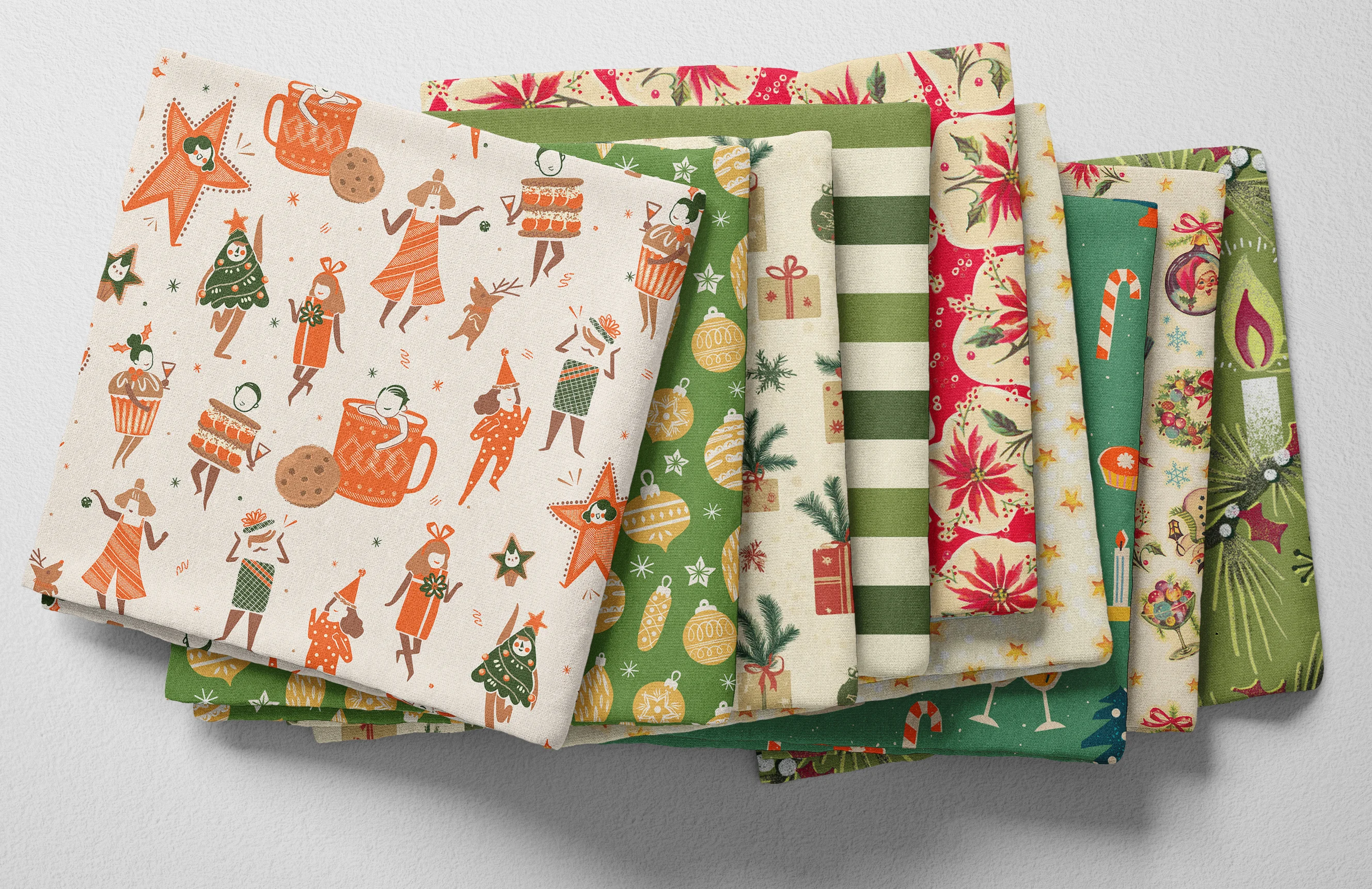 Colorful folded Spoonflower fabric with a midcentury modern christmas theme.