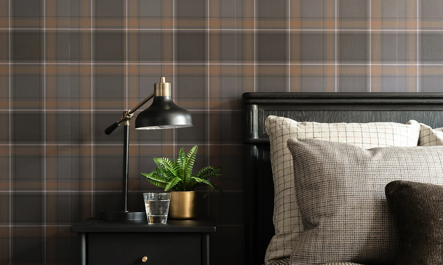 Bedroom with grey plaid wallpaper.