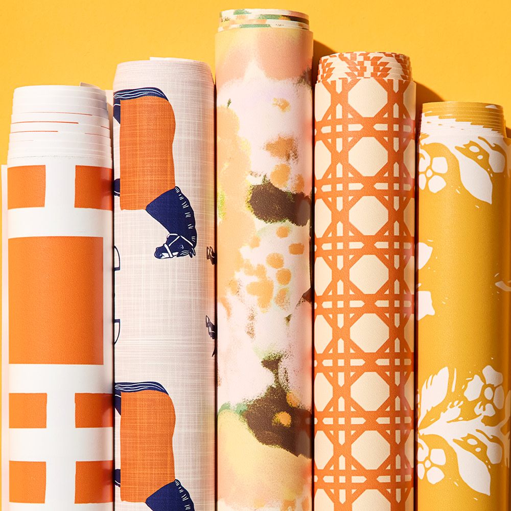 Rolls of orange wallpaper.