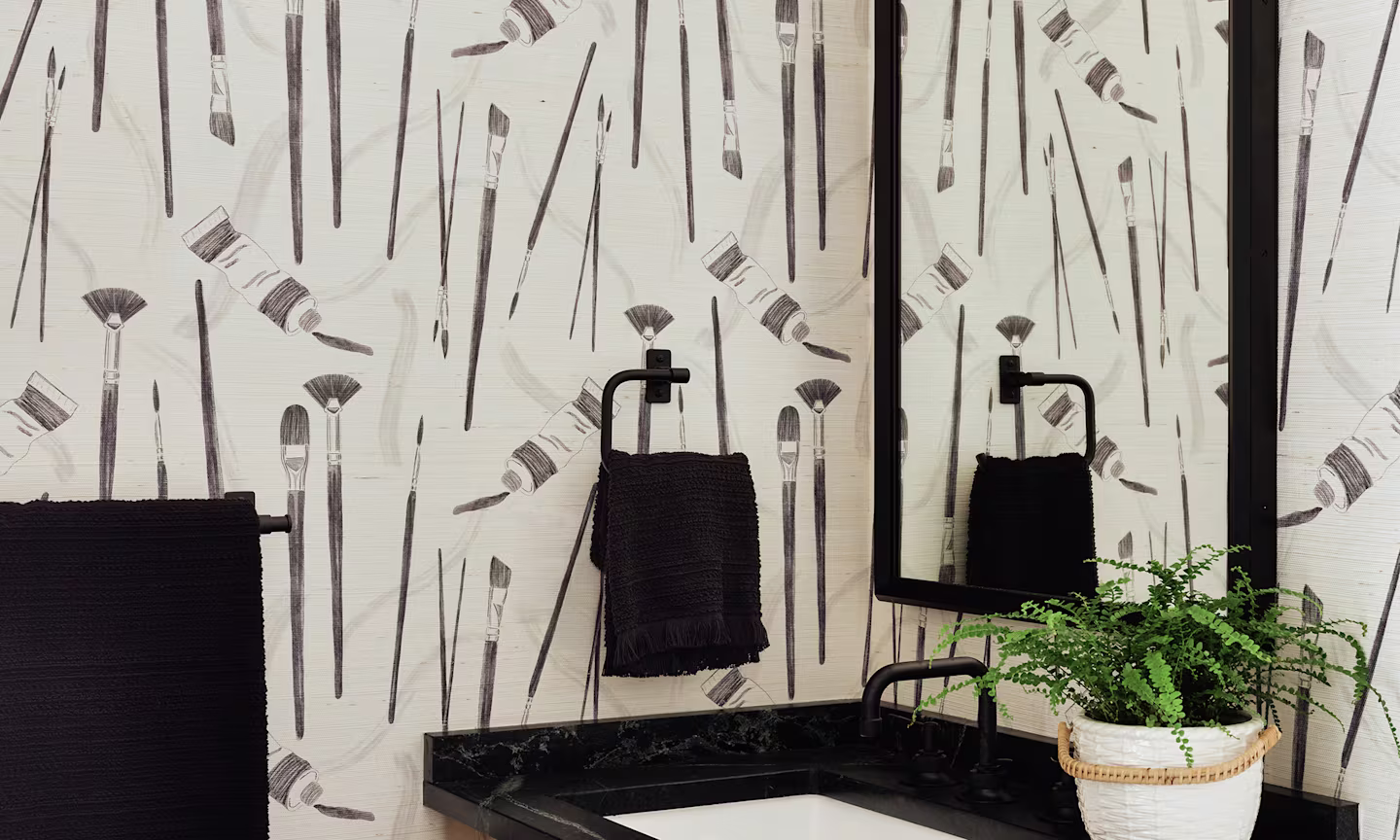 Powder room with paintbrush design grasscloth wallpaper.