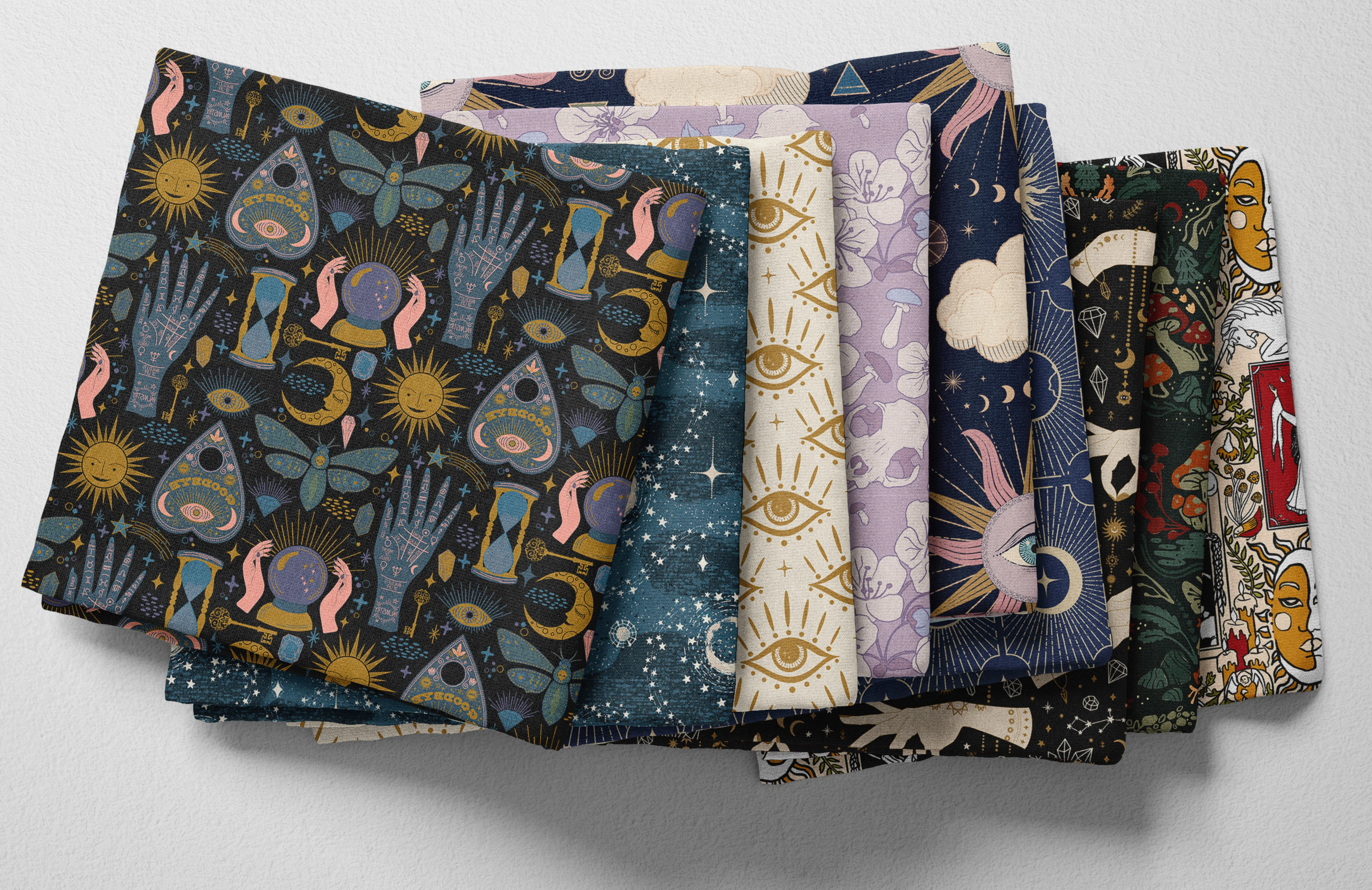 Colorful folded Spoonflower fabric with a whimsigoth theme