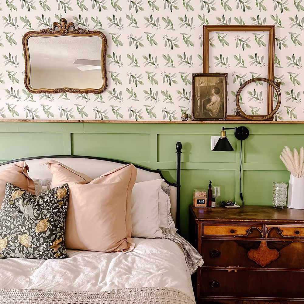Watercolor foliage wallpaper in a bedroom.