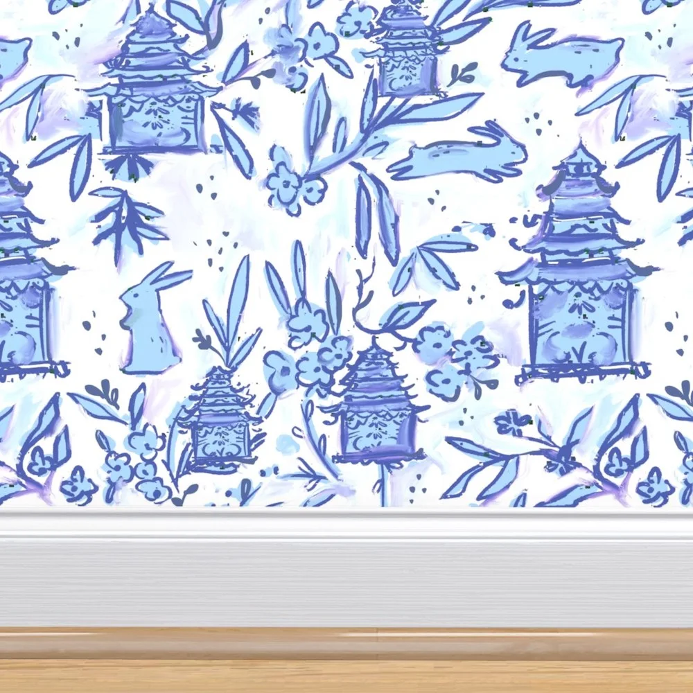 Nursery with blue bow print wallpaper