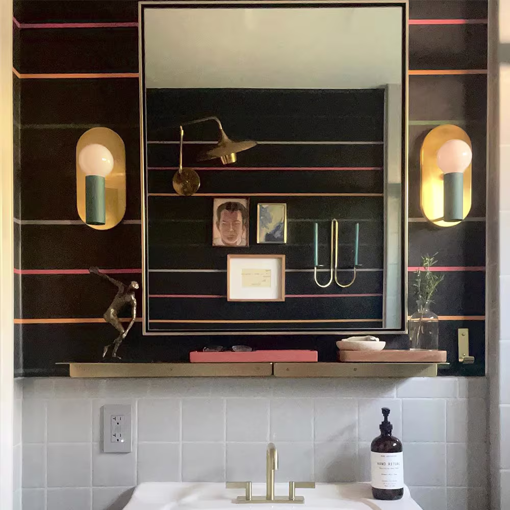 Bathroom with black stripe wallpaper.