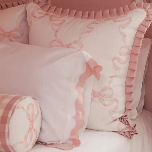 Pink bow bed pillows and shams