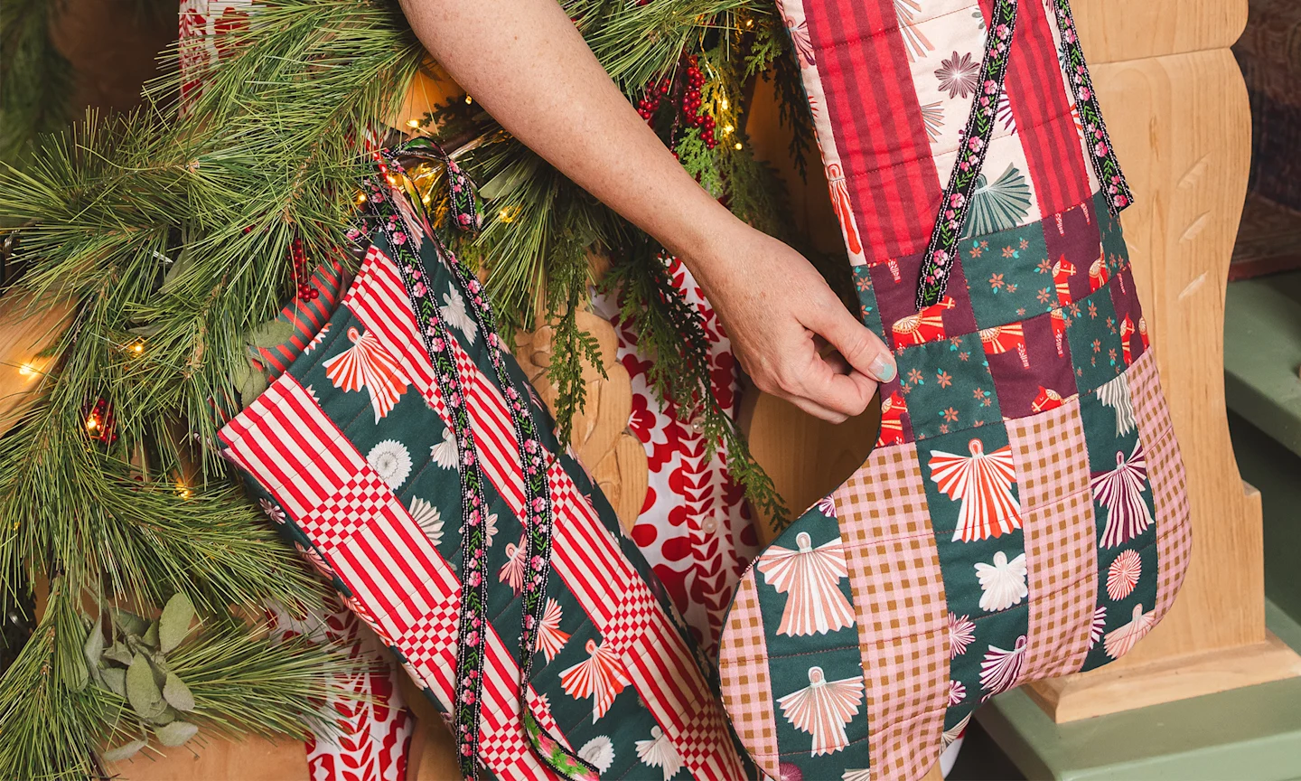 Brittany Jepsen with handmade Christmas stockings.