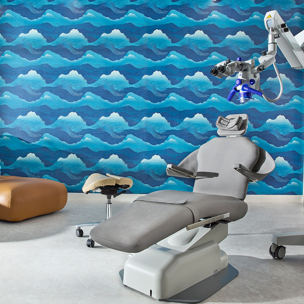 Abstract blue vinyl wallpaper design in a prosthodontics office.
