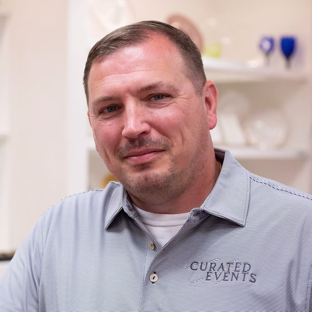 Headshot of a white male in a polo with CURATED EVENTS embroidered on it.