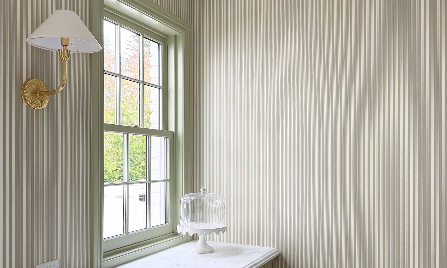 Kitchen with green striped wallpaper.