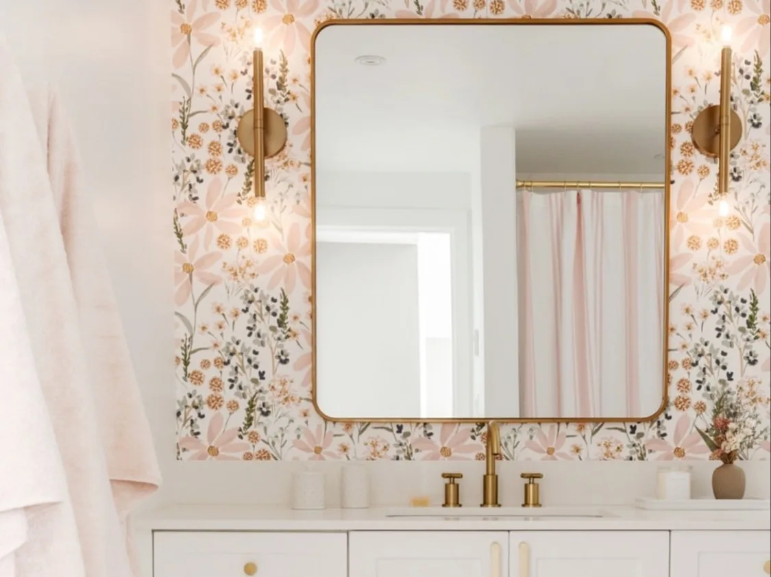 A light and airy bathroom with neutral floral wallpaper with an indybloomdesign print