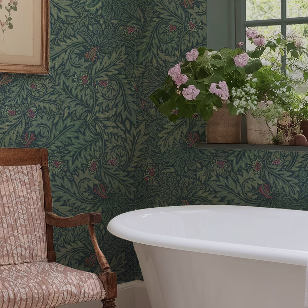 Green floral damask craft revival wallpaper and botanical curtains above a vintage table.