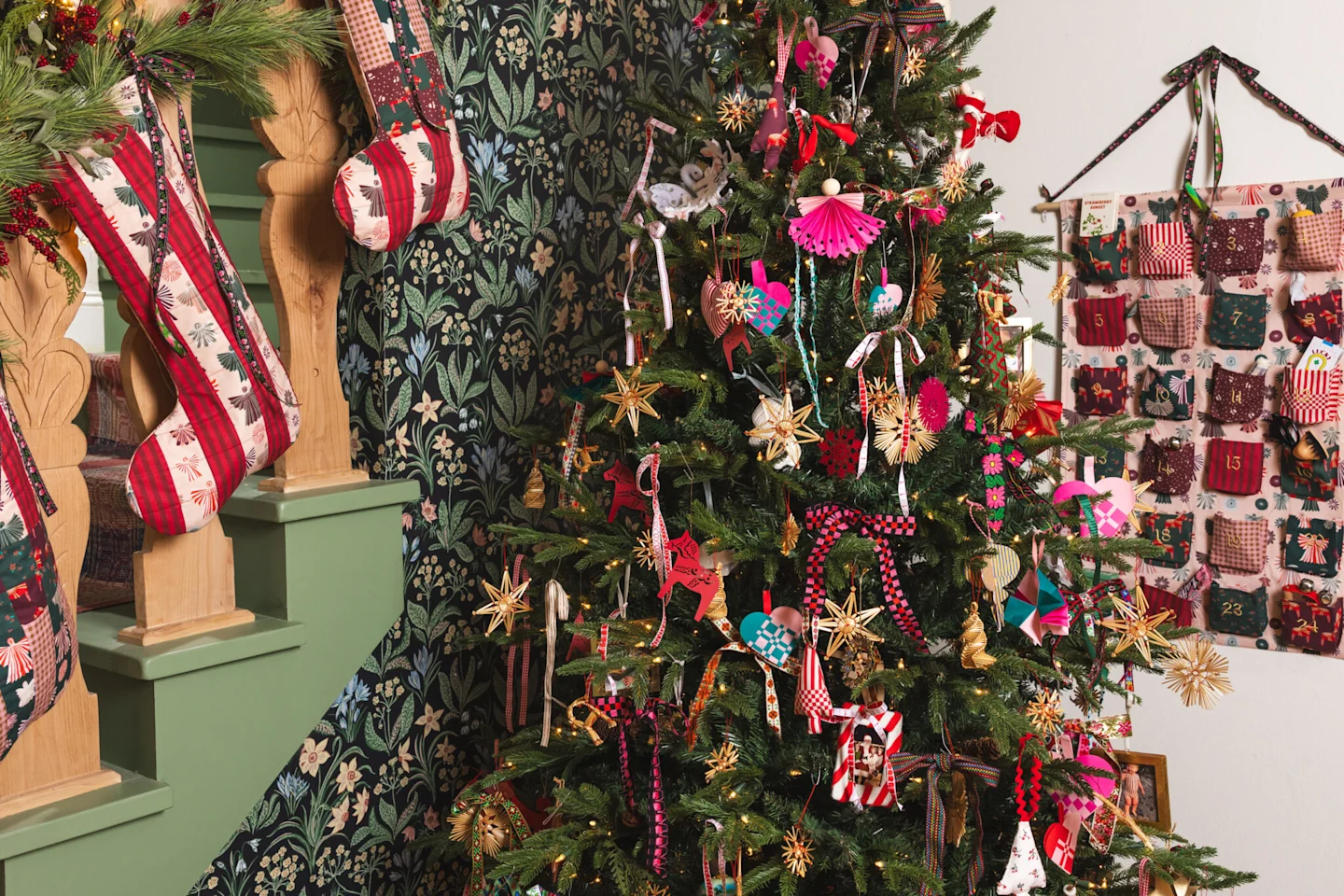 Photo of Brittany of The House That Lars Built home decorated for Christmas with handmade Christmas stocking, a tree and an advent calendar.
