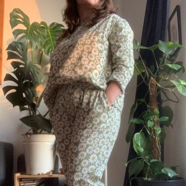 Michelle wearing her green joggers with white daisies