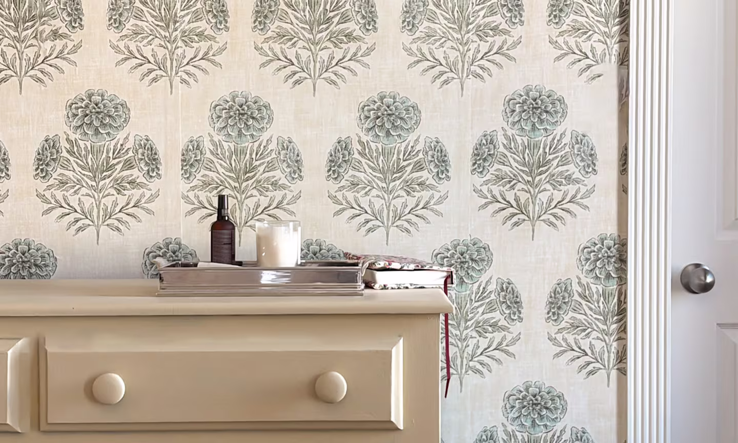 Bedroom with wallpaper in Marigold  by byre_wilde above a warm yellow dresser.
