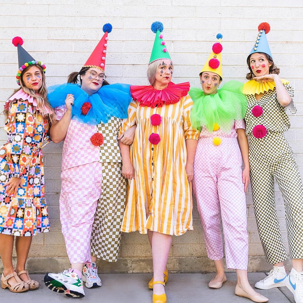 Five people in outfits made with The House That Lars Built Designs and clown hats & collars.