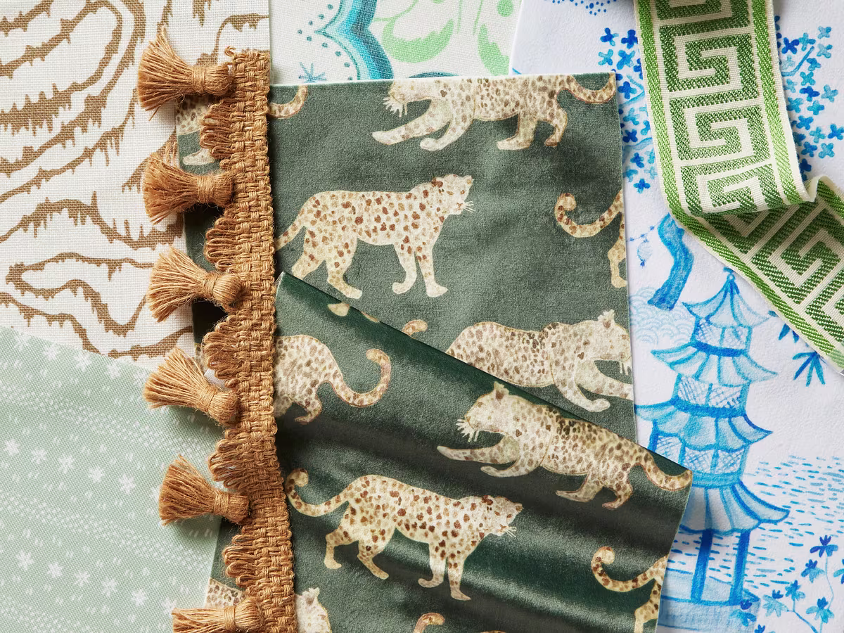 A mix of fabrics and wallpapers featuring leopards printed on Celosia Velvet