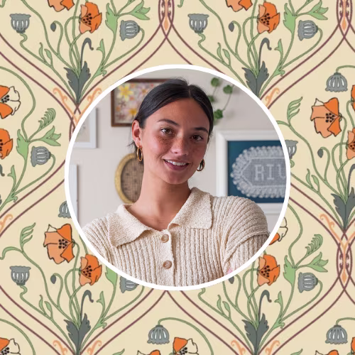 Mya Riviera of Mya Kaye Made in front of an Art Nouveau style design.