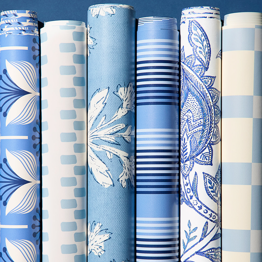 Rolls of blue wallpaper.