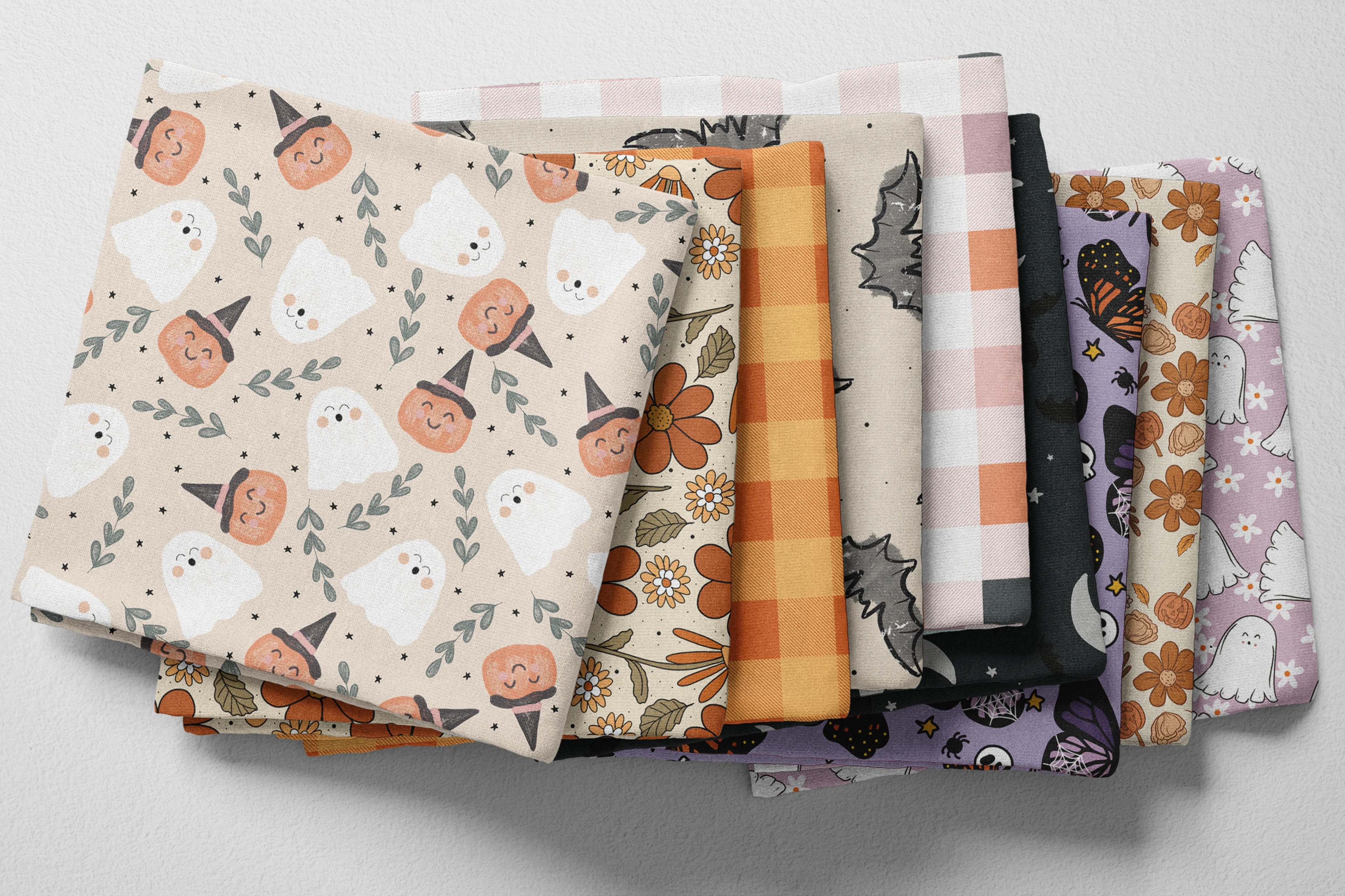 Colorful folded Spoonflower fabric with a cute halloween theme