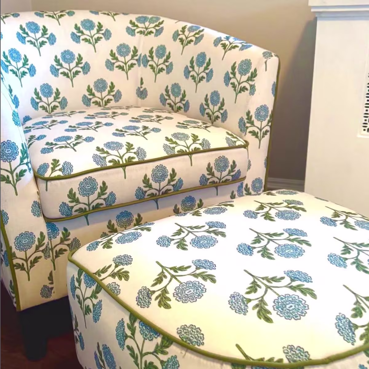 A rustic farmhouse floral chair and ottoman made with recycled canvas
