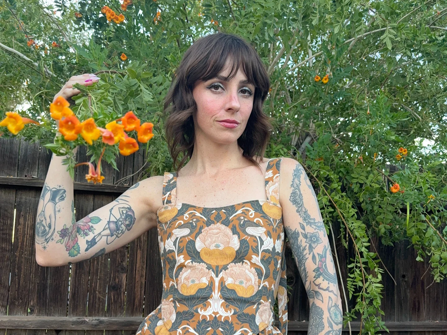 A closeup of Kelsey Garner in her boho earth tone dress