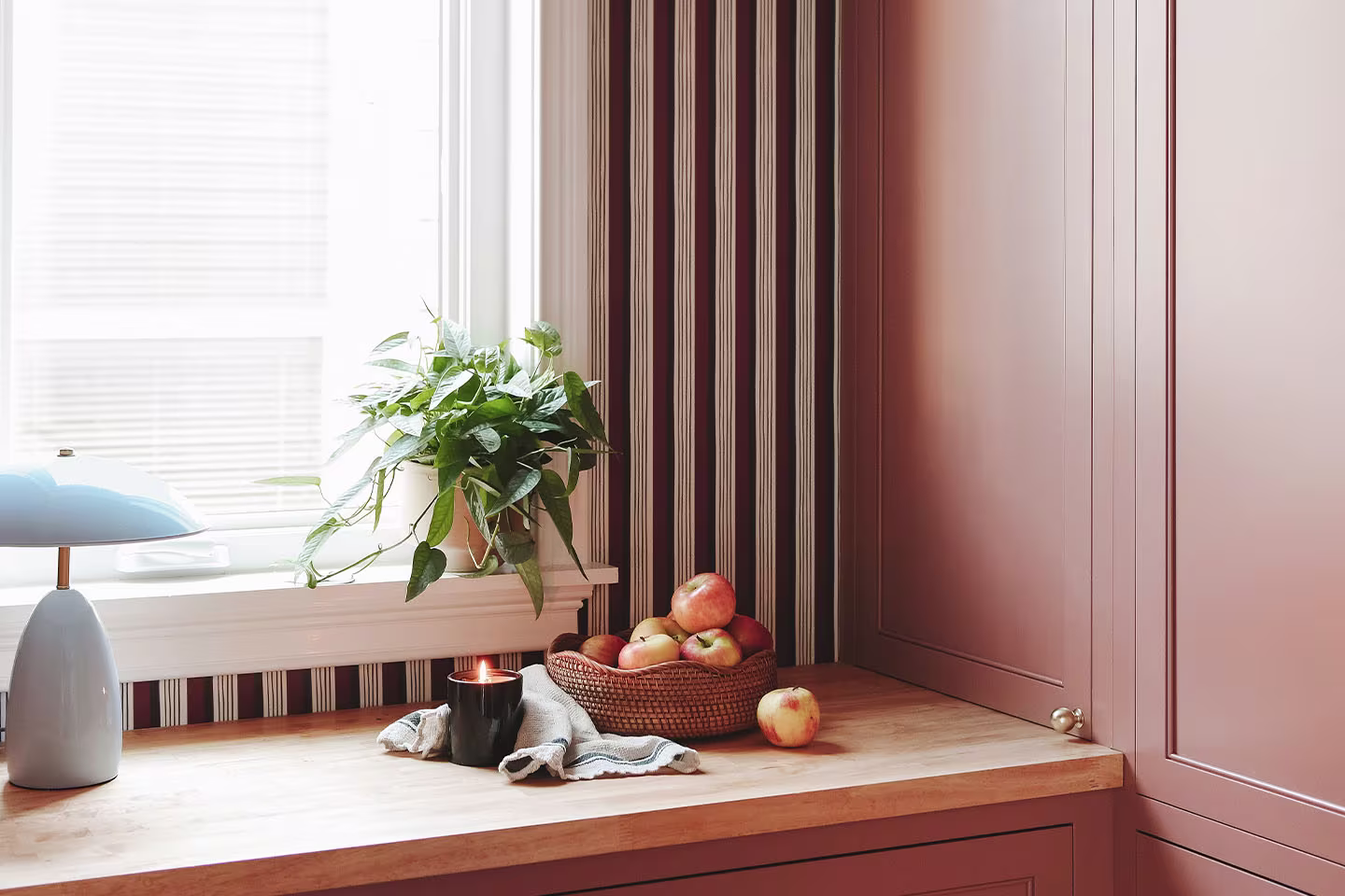 Pantry transformation using Spoonflower wallpaper with bold stripes.