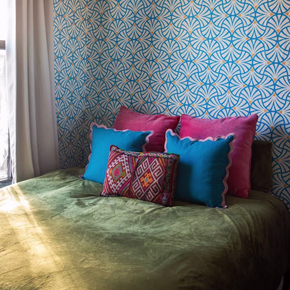 Blue scallop print wallpaper in bedroom