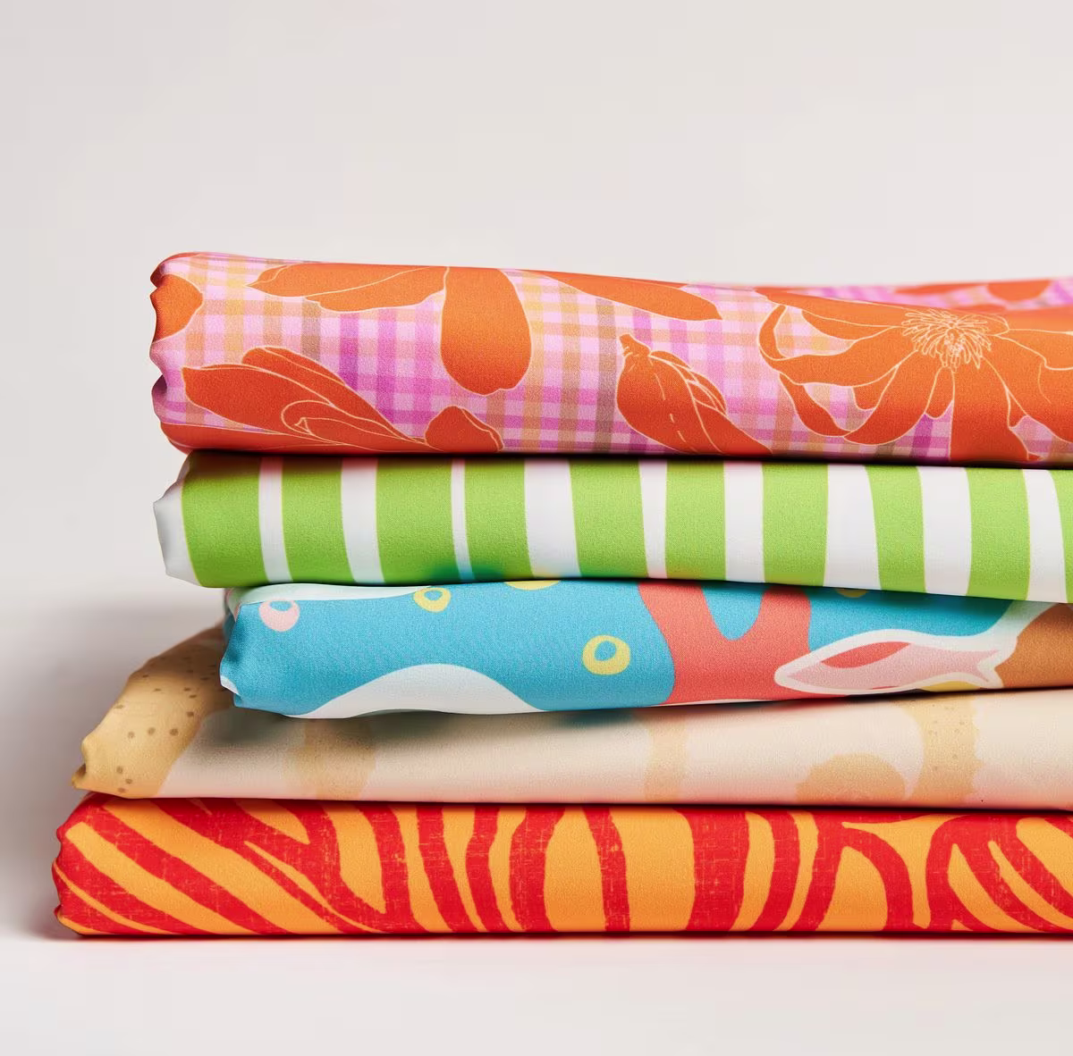 A bright stack of designs in sport stretch woven