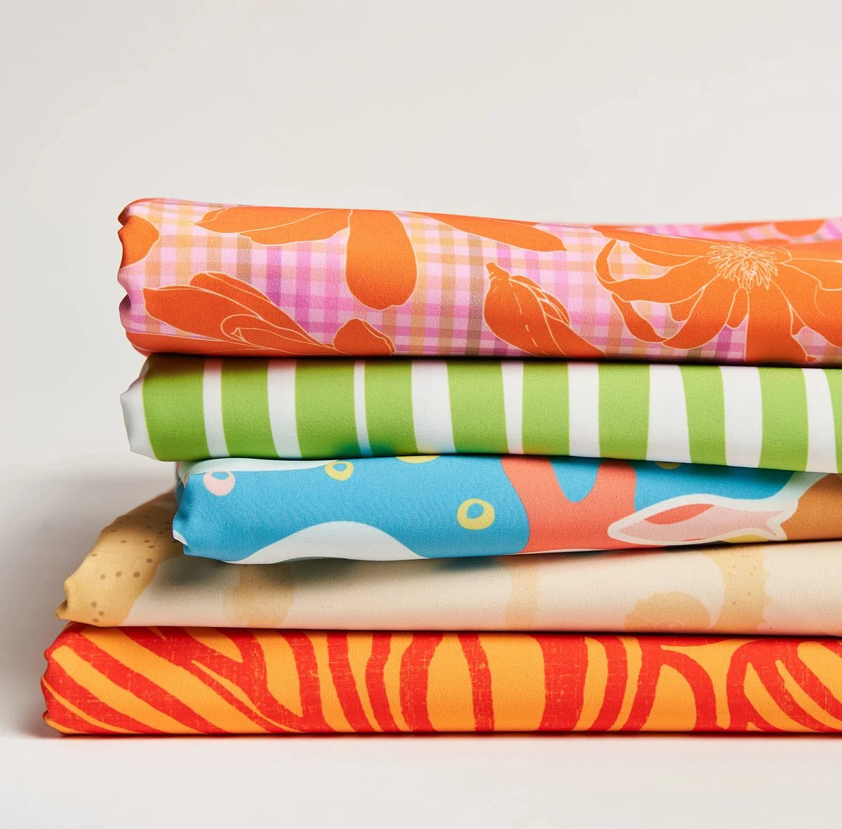 A bright stack of designs in sport stretch woven
