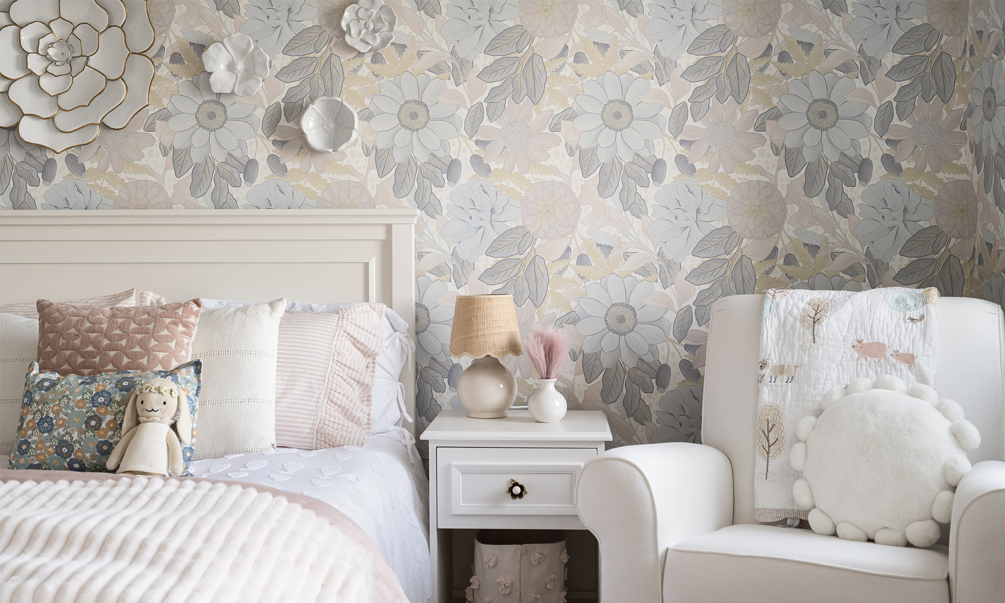 Kids room with large neutral floral peel and stick wallpaper.