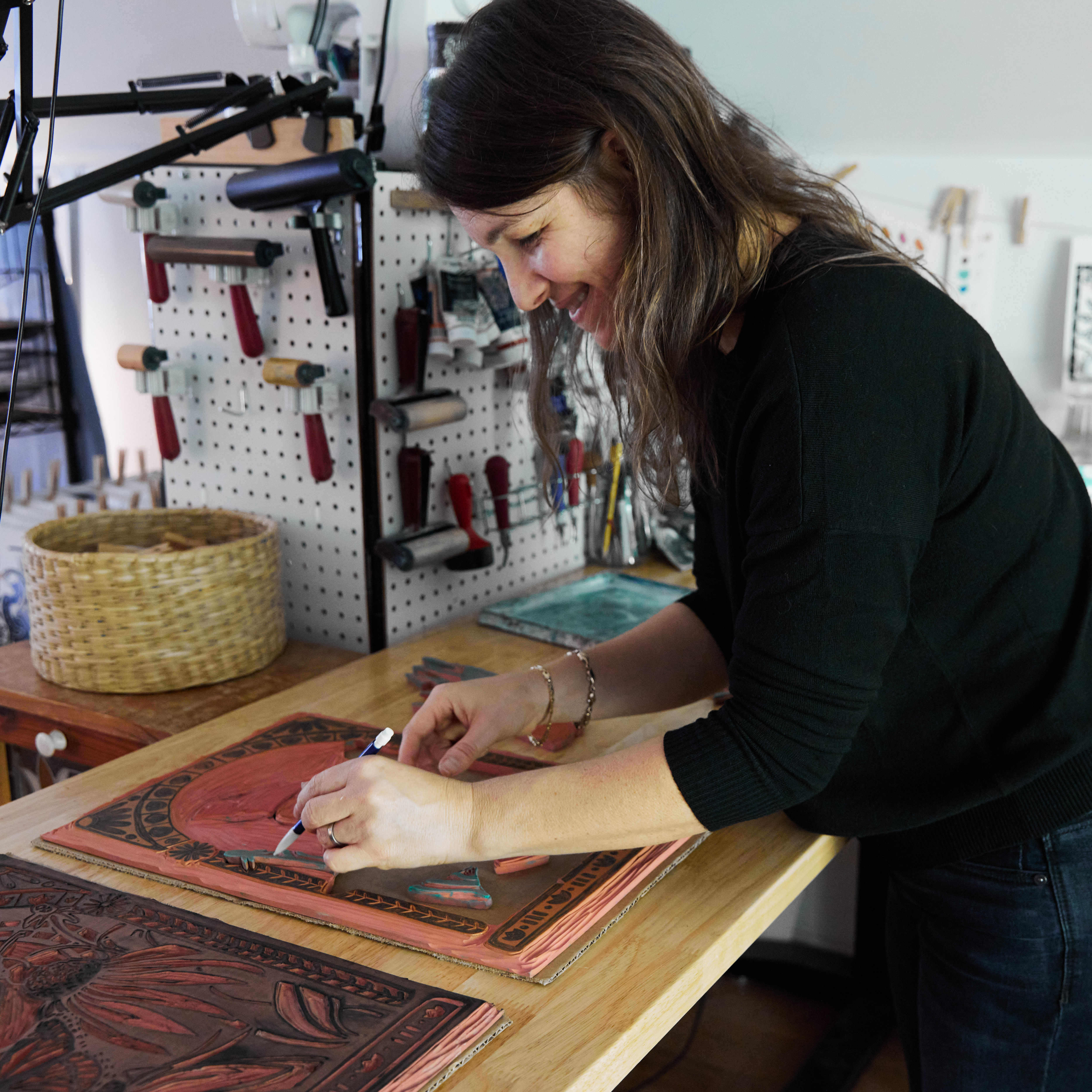 Artist Katie Hayes working on a block print