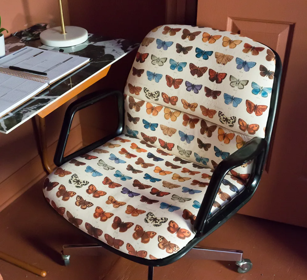 Upholstered chair with butterflies