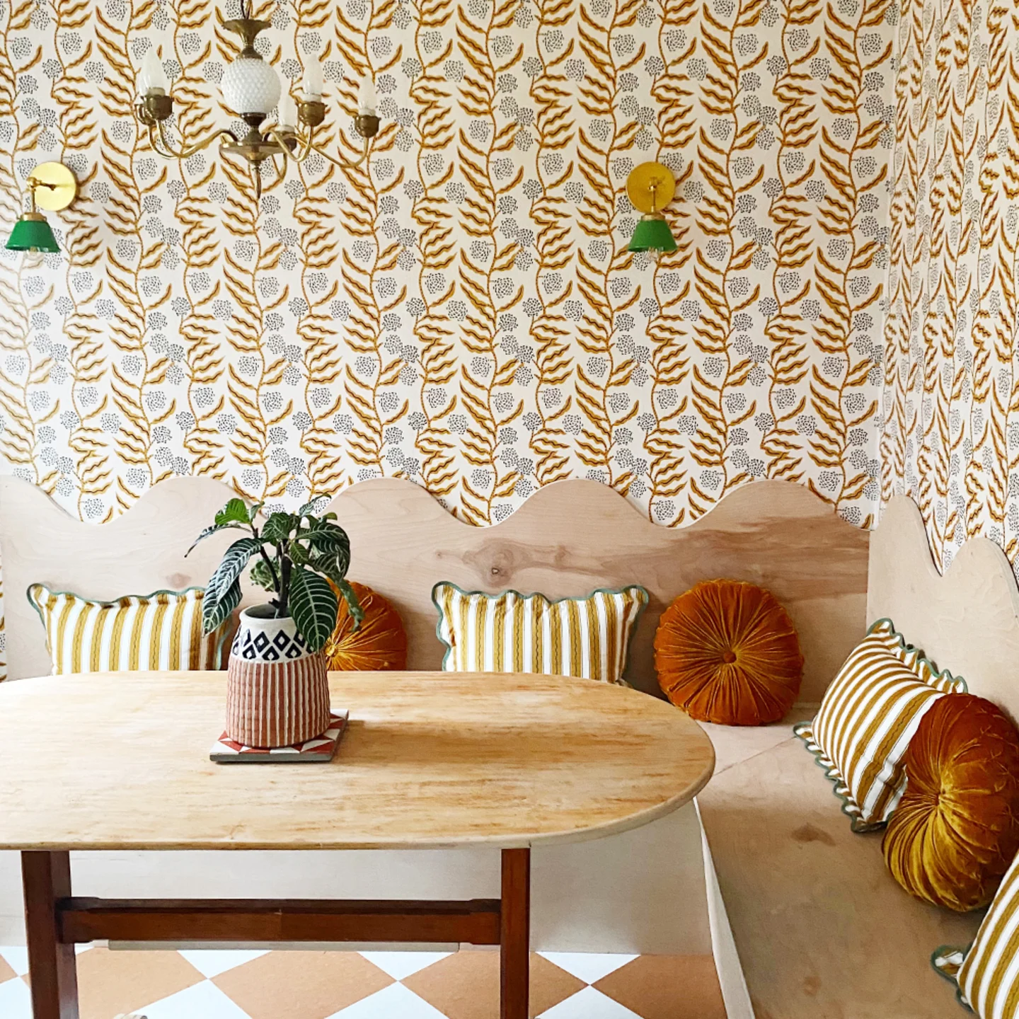Orange floral fine wallpaper in a kitchen breakfast nook.