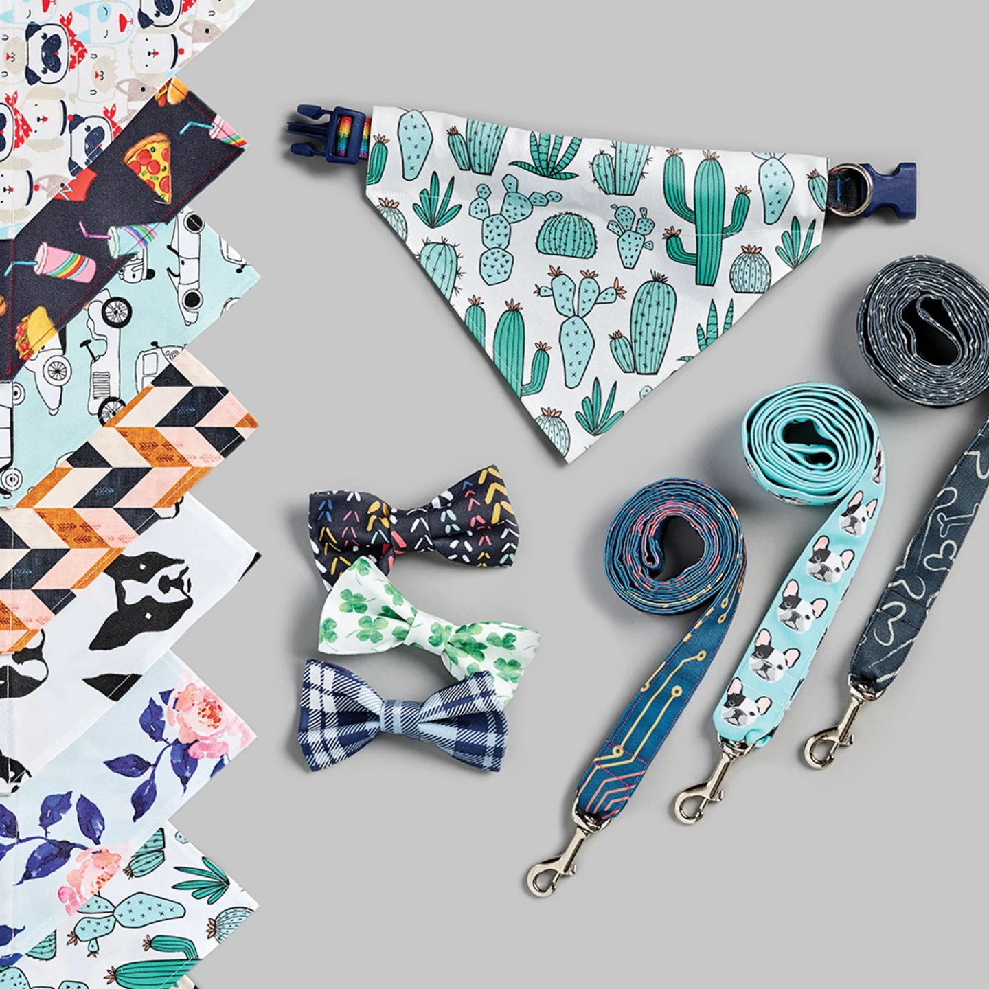 Pet bandanas leashes and collars on a grey background.