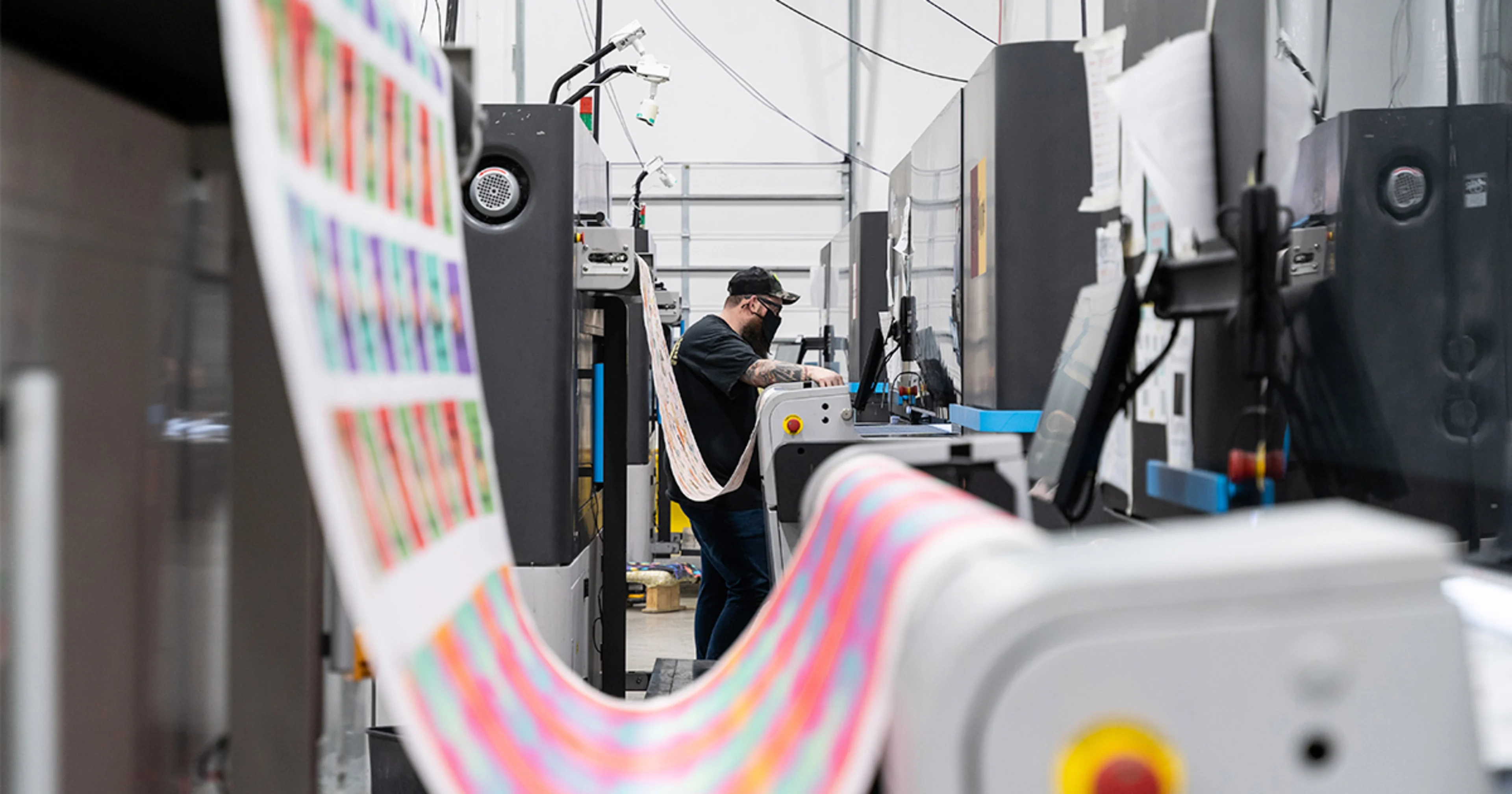 factory printer with roll of wallpaper being printed