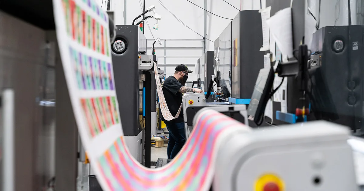factory printer with roll of wallpaper being printed