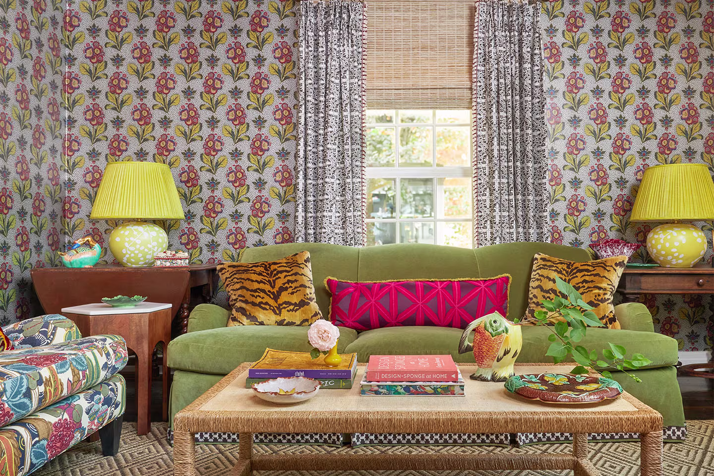 Maximalist living room with Spoonflower patterned wallpaper, curtains, and pillows for a bold look.