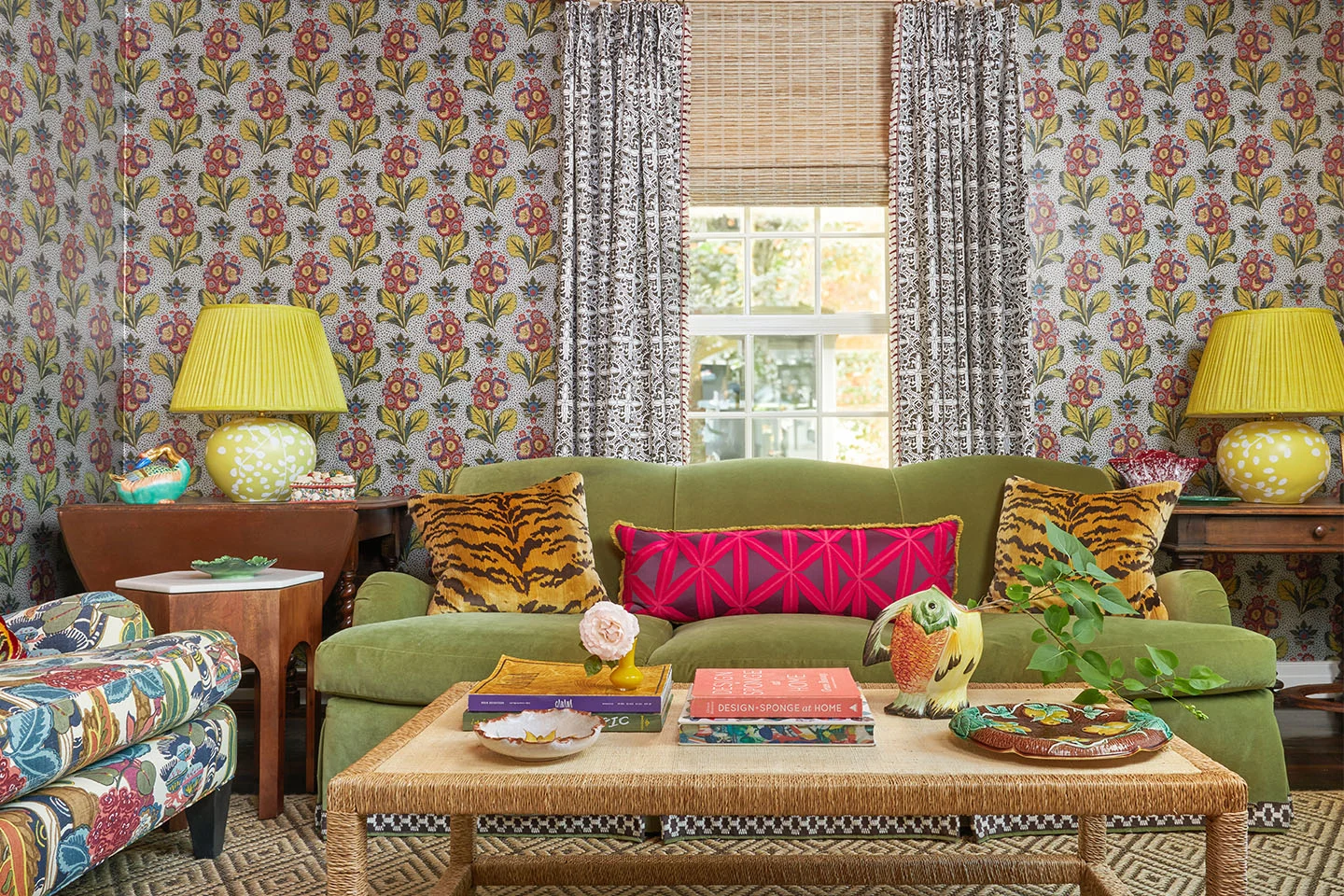 Maximalist living room with Spoonflower patterned wallpaper, curtains, and pillows for a bold look.