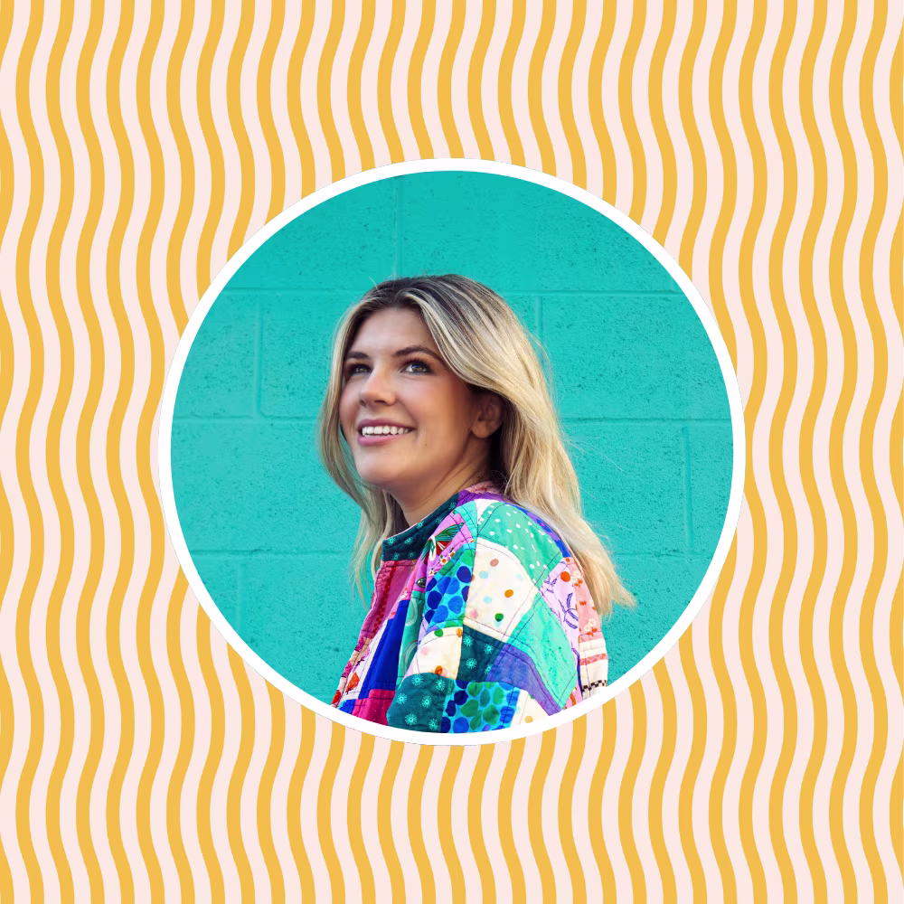 Jenna Hall in front of a yellow wavy stripe design from The House that Lars Built
