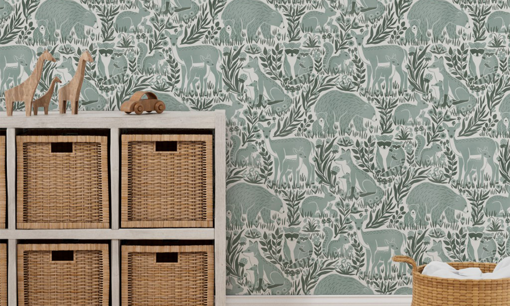 Sage forest animal wallpaper in a nursery.