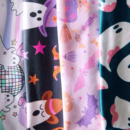 Assortment of Halloween fabric designs featuring ghosts and bats