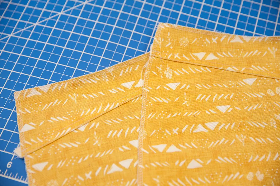 A close up of the yoke being stitched to the back skirt