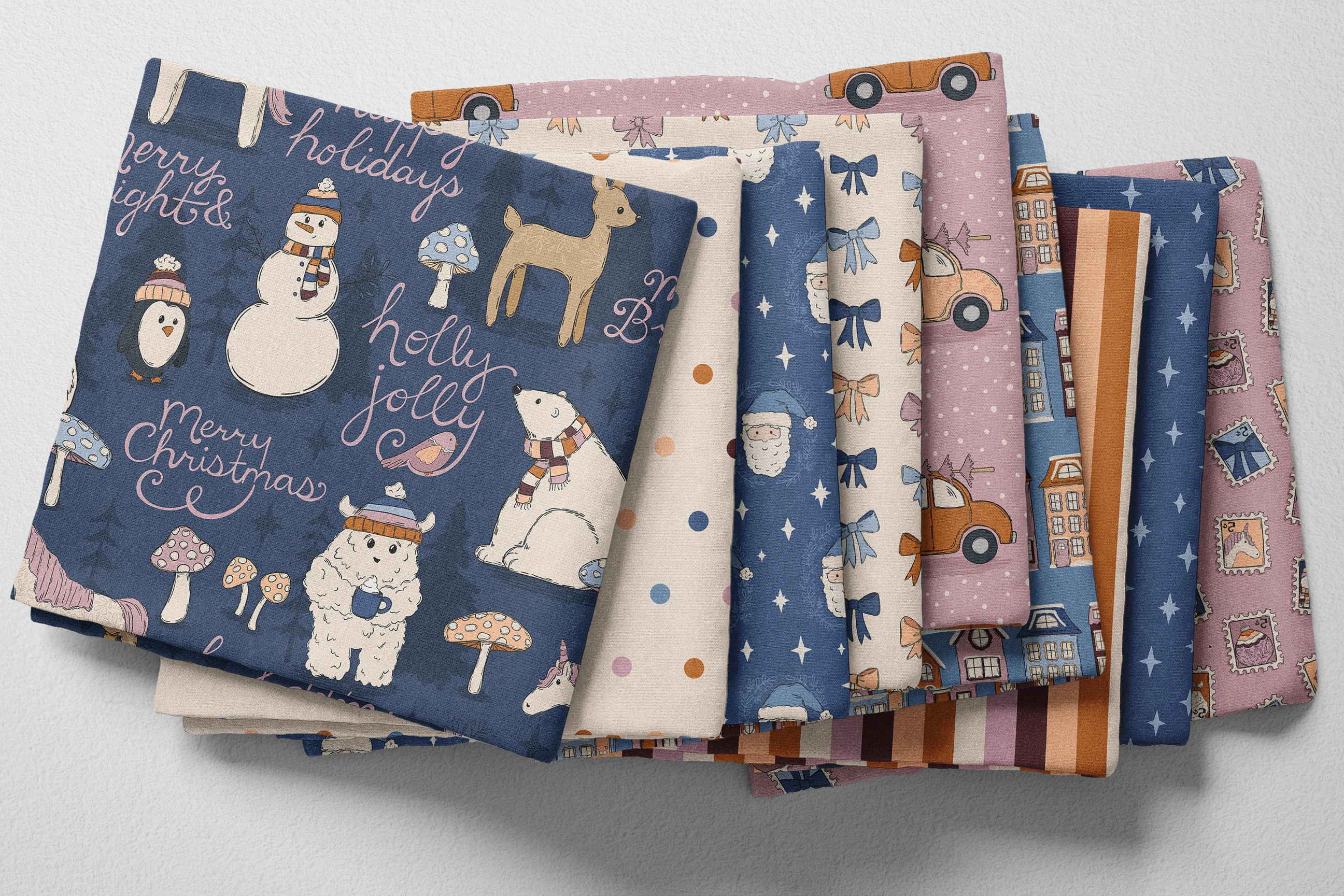 Colorful folded Spoonflower fabric with a blue, pink, and cream holiday pattern