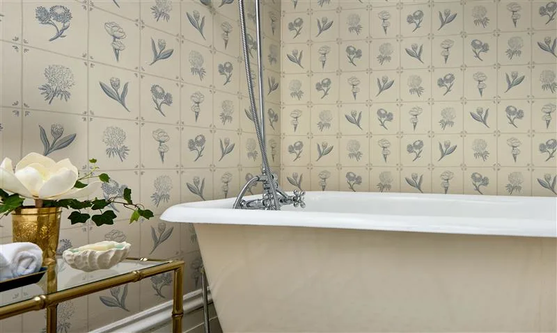 Bathroom with wallpaper in Delft Tile French Country Cottage painted Wildflower cobalt blue off white by milenapatterndesign.