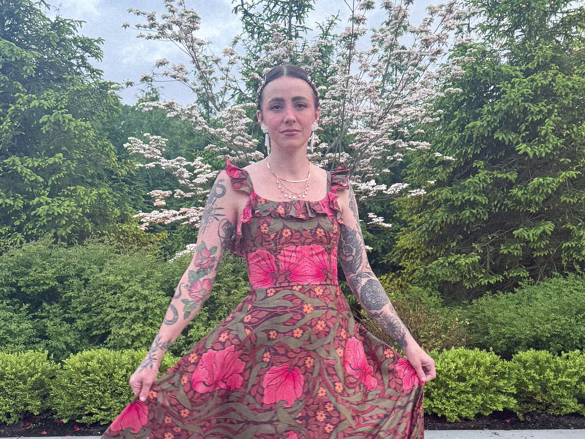 A model in a pink floral maxi dress made with Cotton Silk