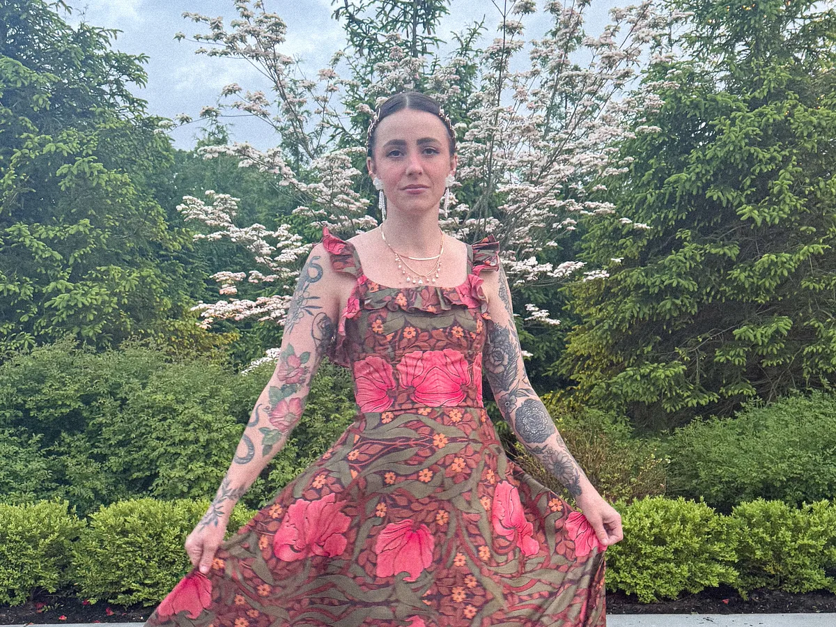 A model in a pink floral maxi dress made with Cotton Silk